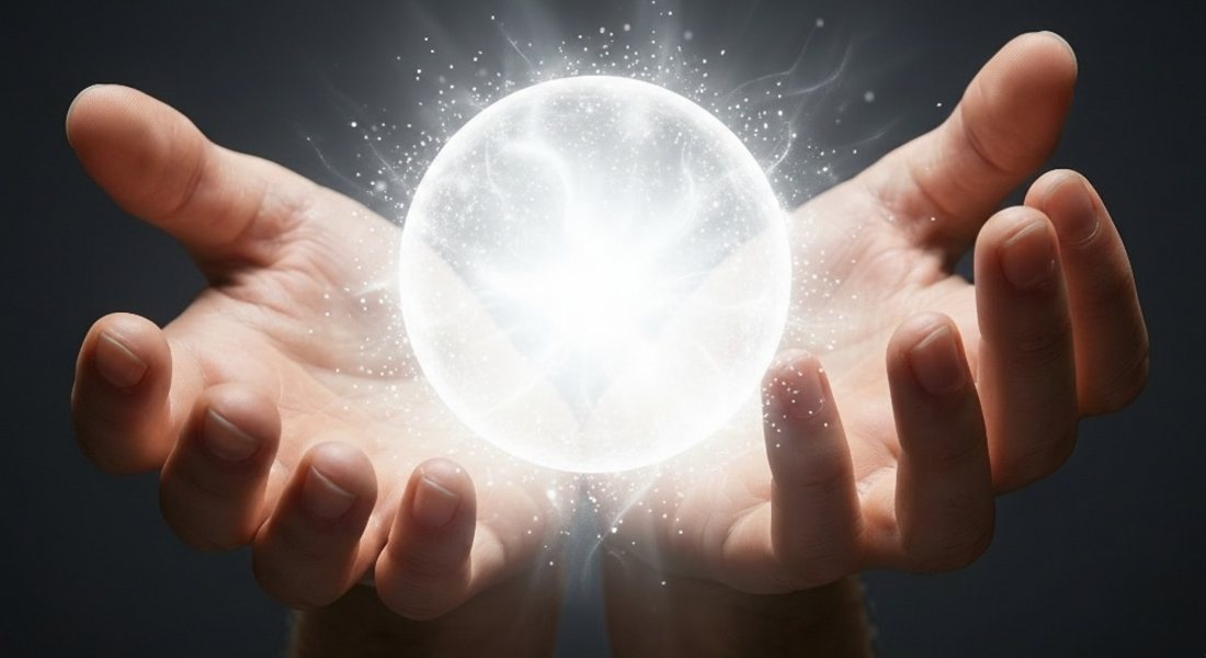 Open hands cupping a glowing white chi ball of light for a distant energy healing attunement.
