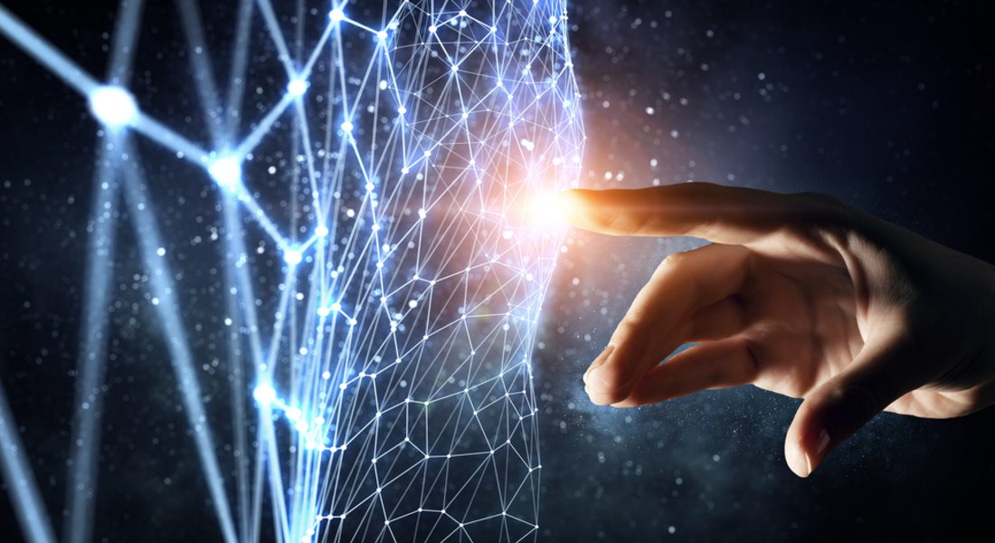 Hand interacting with a network of glowing blue lines against a dark background.