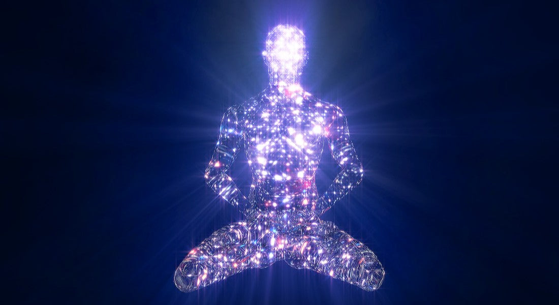 Crystal-like figure in a meditative pose against a dark blue background.