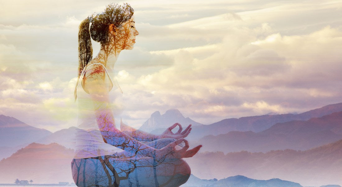 Serene meditative person with a mountainous landscape overlay.