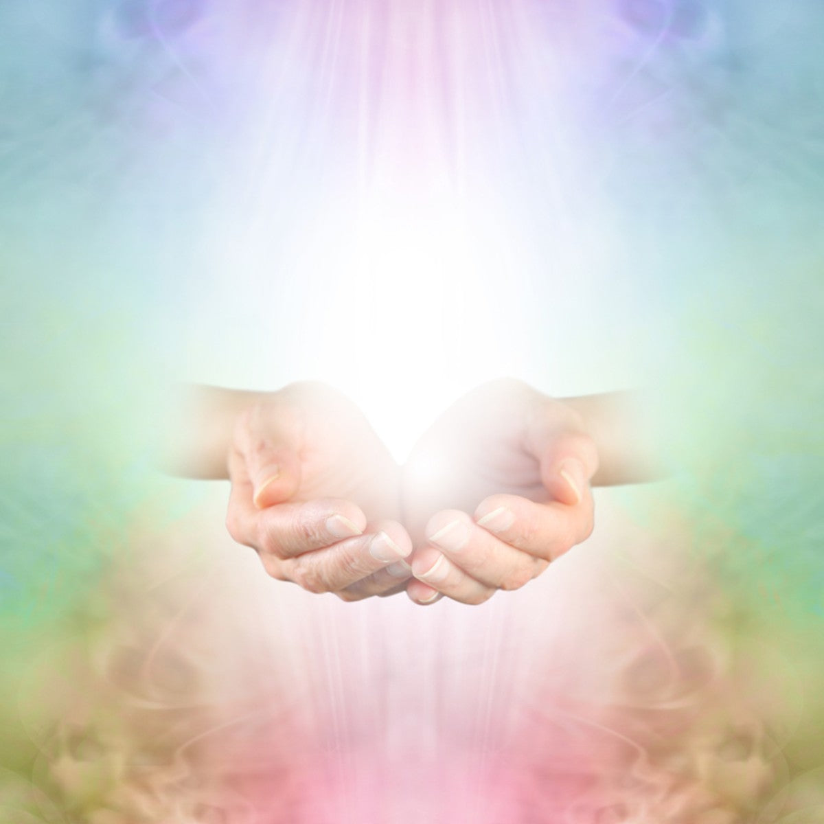 Two hands reaching towards each other against a soft Reiki energy background.