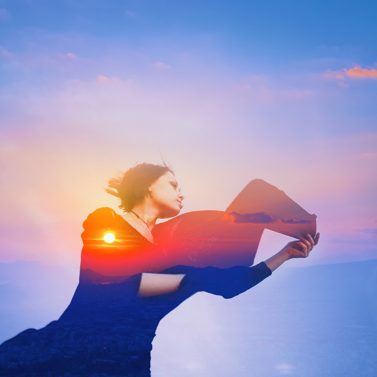 Double-exposed person over clouds and a breeze with a sunset in the background.