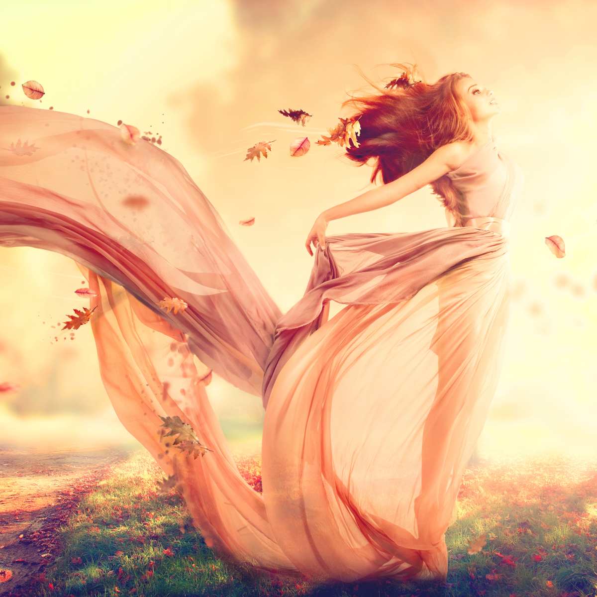 A woman in a flowing gown, with autumn leaves swirling around her, representing angels of veil removal connection.