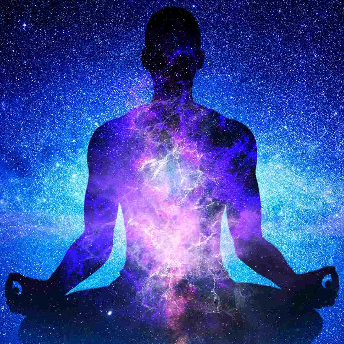 Silhouette of a person meditating with a cosmic, starry background representing the energy of the Arcturians.