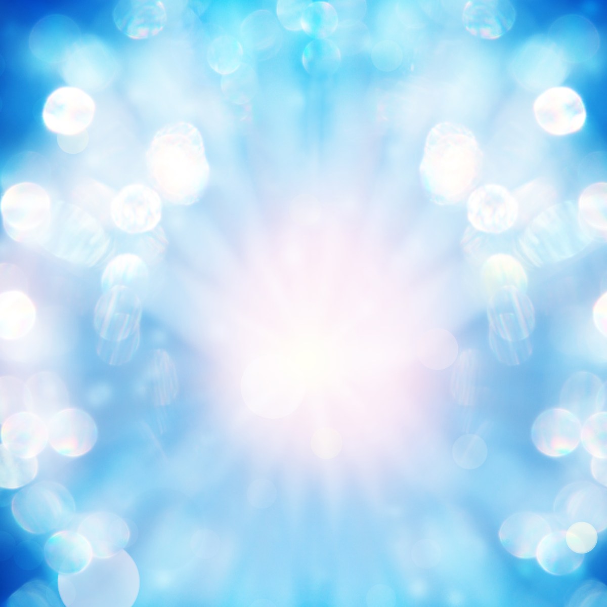 Radiant light burst with soft blue bokeh circles and white glowing rays radiating from the centre.