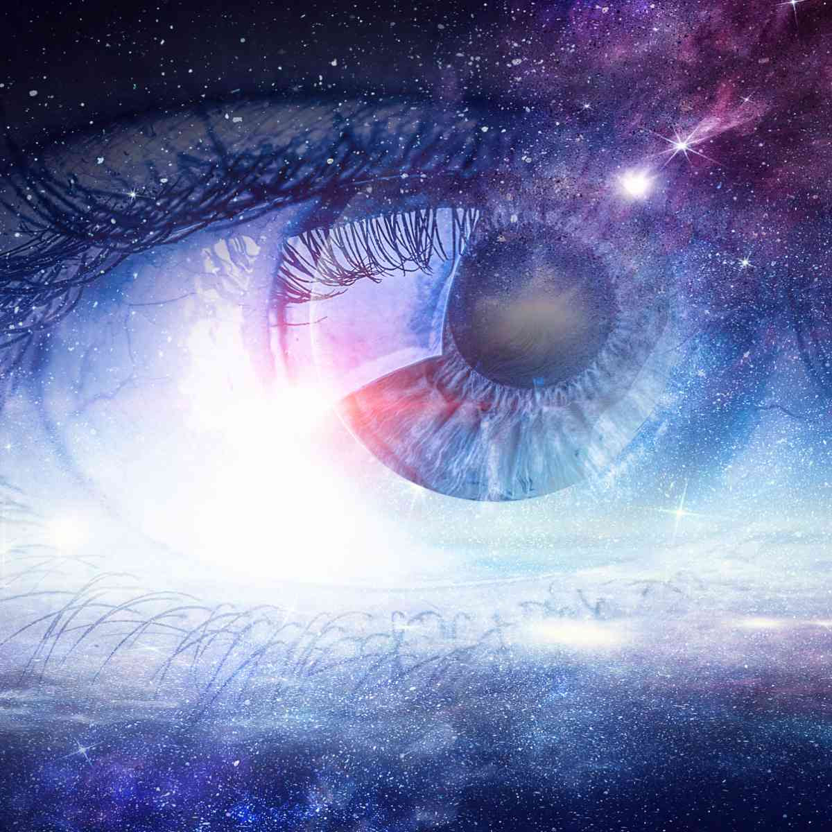 Close-up of an eye infused with the night sky, radiating luminous violet and blue light, symbolising clairvoyance.