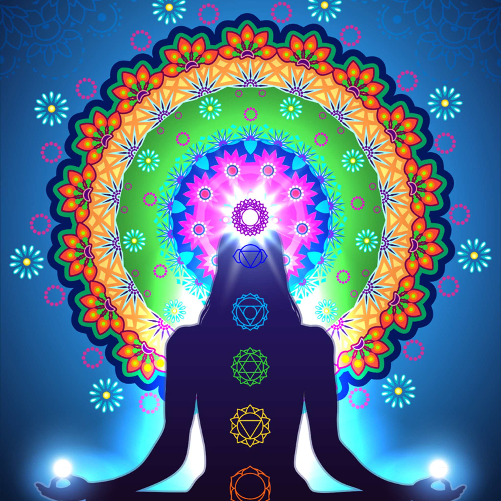 A silhouette of a meditating figure against a bright blue background, with the seven main chakras glowing and a large, vibrantly coloured mandala centred around the glowing Crown Chakra.
