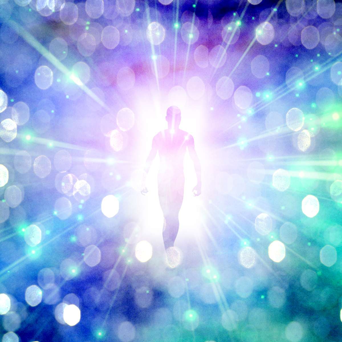 Silhouette of a person against a vibrant, multicoloured light burst background.
