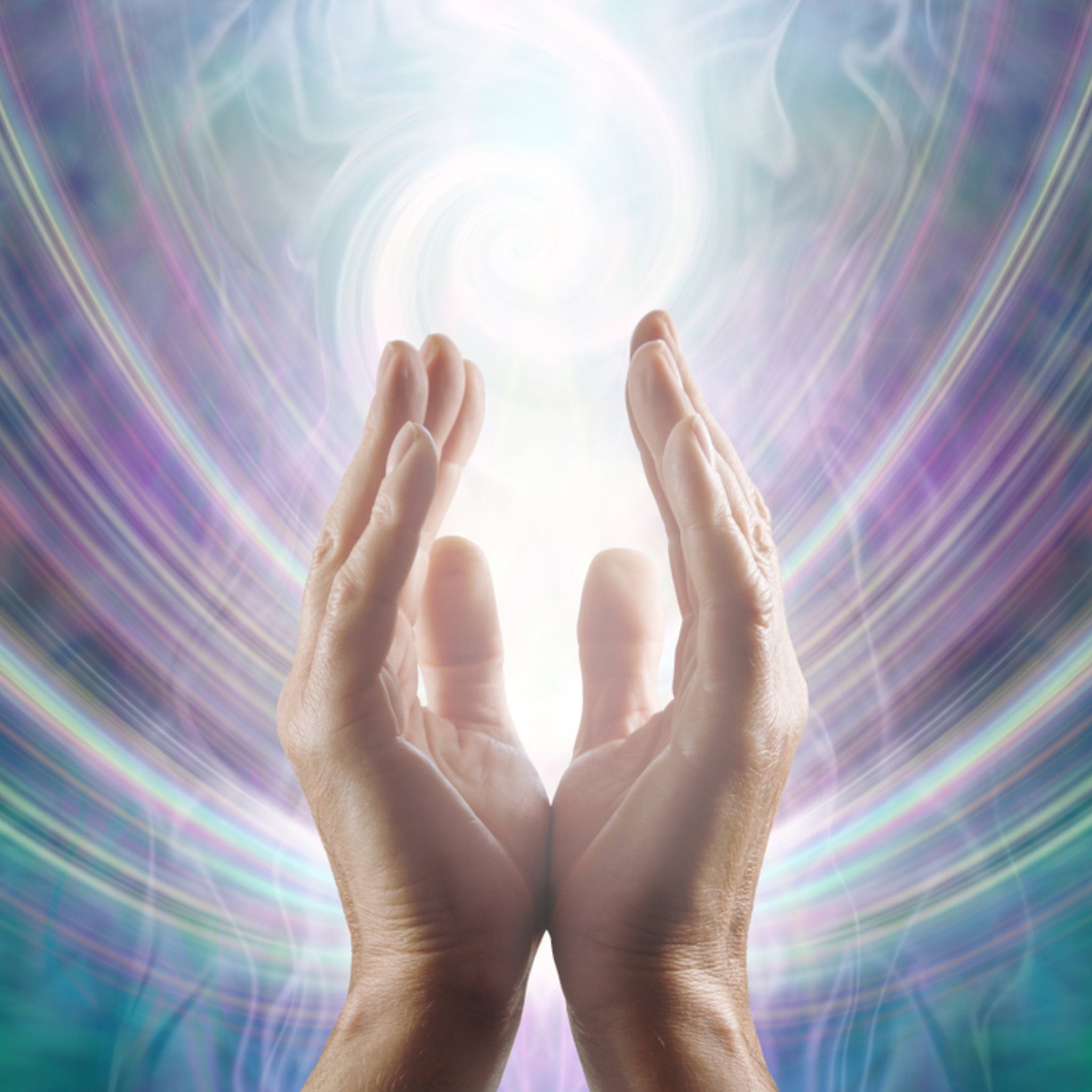 A close-up photograph of two hands held upwards in a cupping gesture, bathed in a white light that streams down from a glowing vortex above. The background is a soft, swirling pattern of concentric arcs in bright purple, turquoise, and magenta, symbolising the channelled Reiki energy.