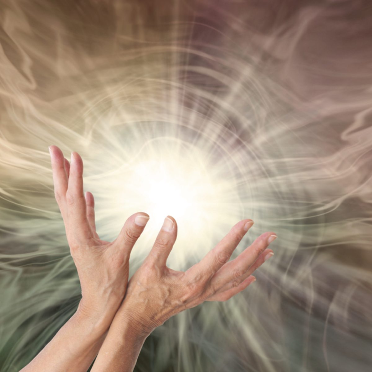 Two hands reaching towards a bright Reiki Grand Master light source, with swirling energy in the background.