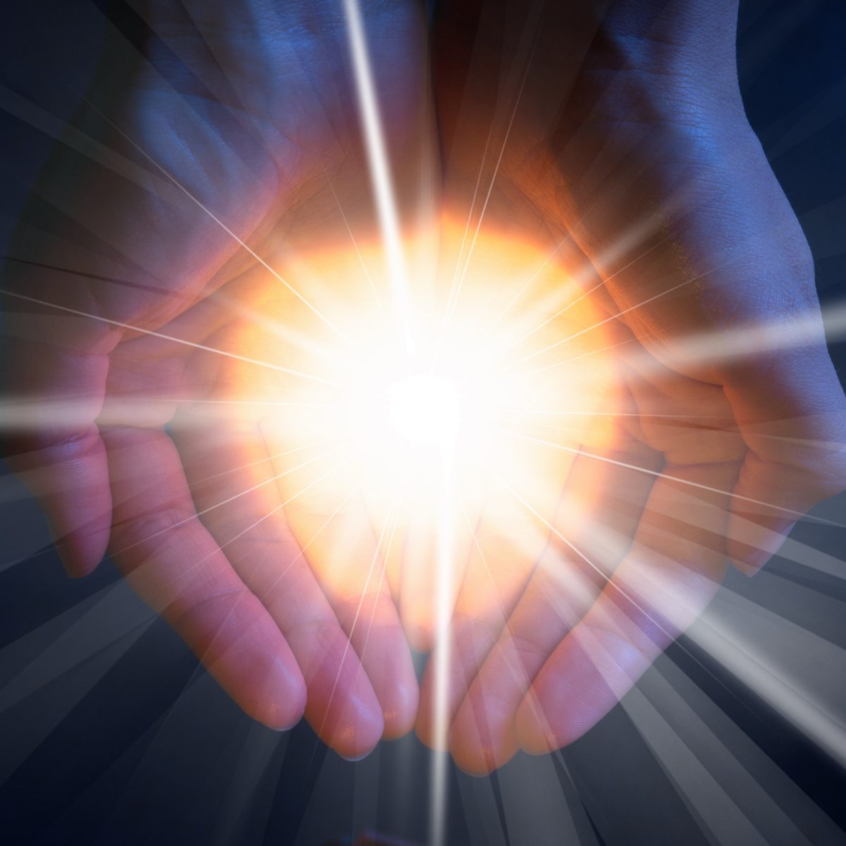 Hands cupping a bright light source with rays extending outward representing soul retrieval.
