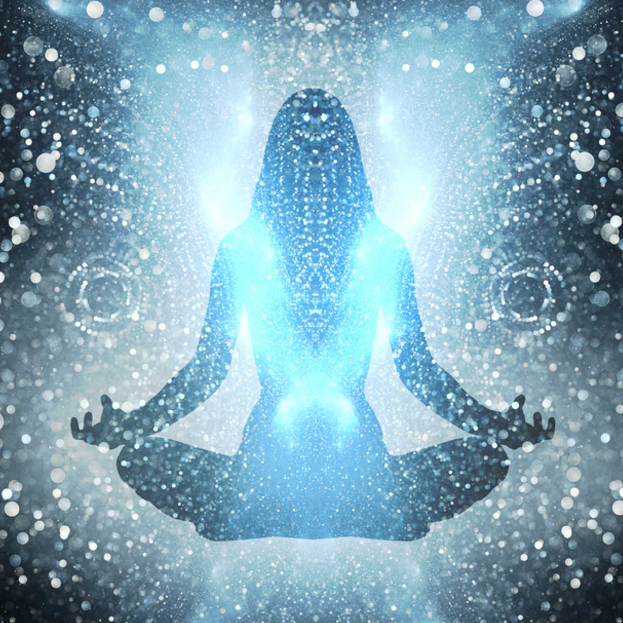 An abstract digital image of a figure seated in meditation, silhouetted by an intense, blue-white light surrounded by dissolving energetic particles, symbolising a total energetic reset and purification.