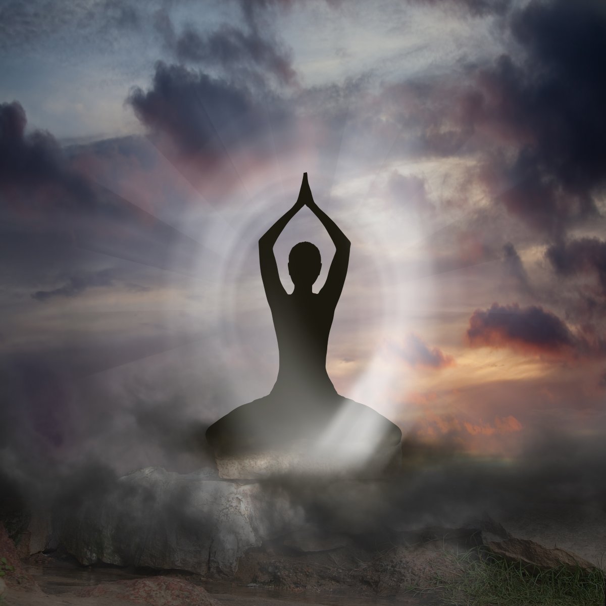 Silhouette of a person in a yoga pose against a dramatic sky with clouds and sun surrounded by protective white light.