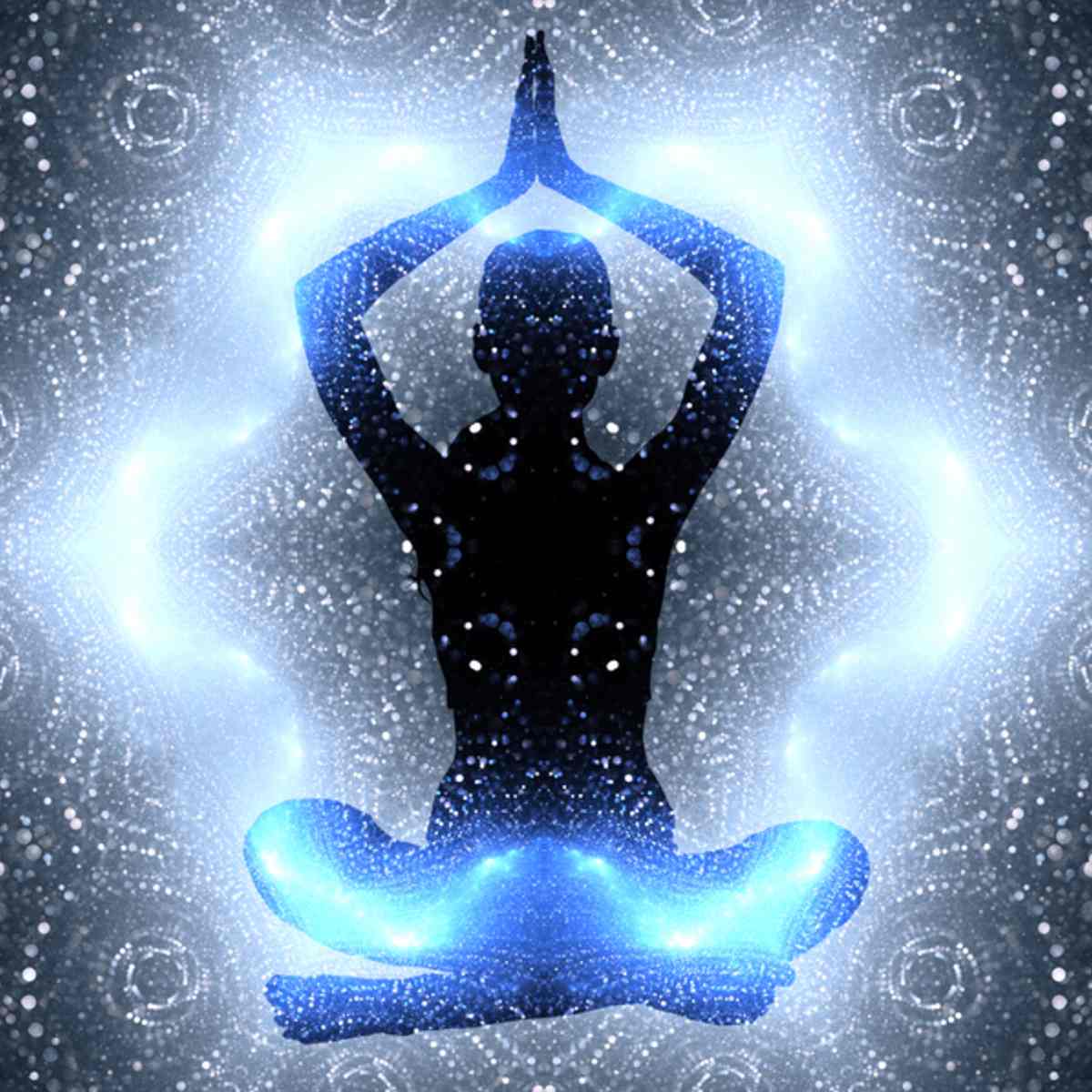 Silhouette of a person in a meditative pose surrounded by blue energy effects against a starry background.