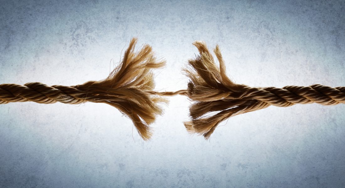 Torn rope on a textured grey background symbolising 20 ways to cut etheric cords.