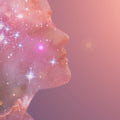 A visual representation of a person with a compassionate expression, surrounded by a starry cosmic background, symbolising spirituality or clairsentience.