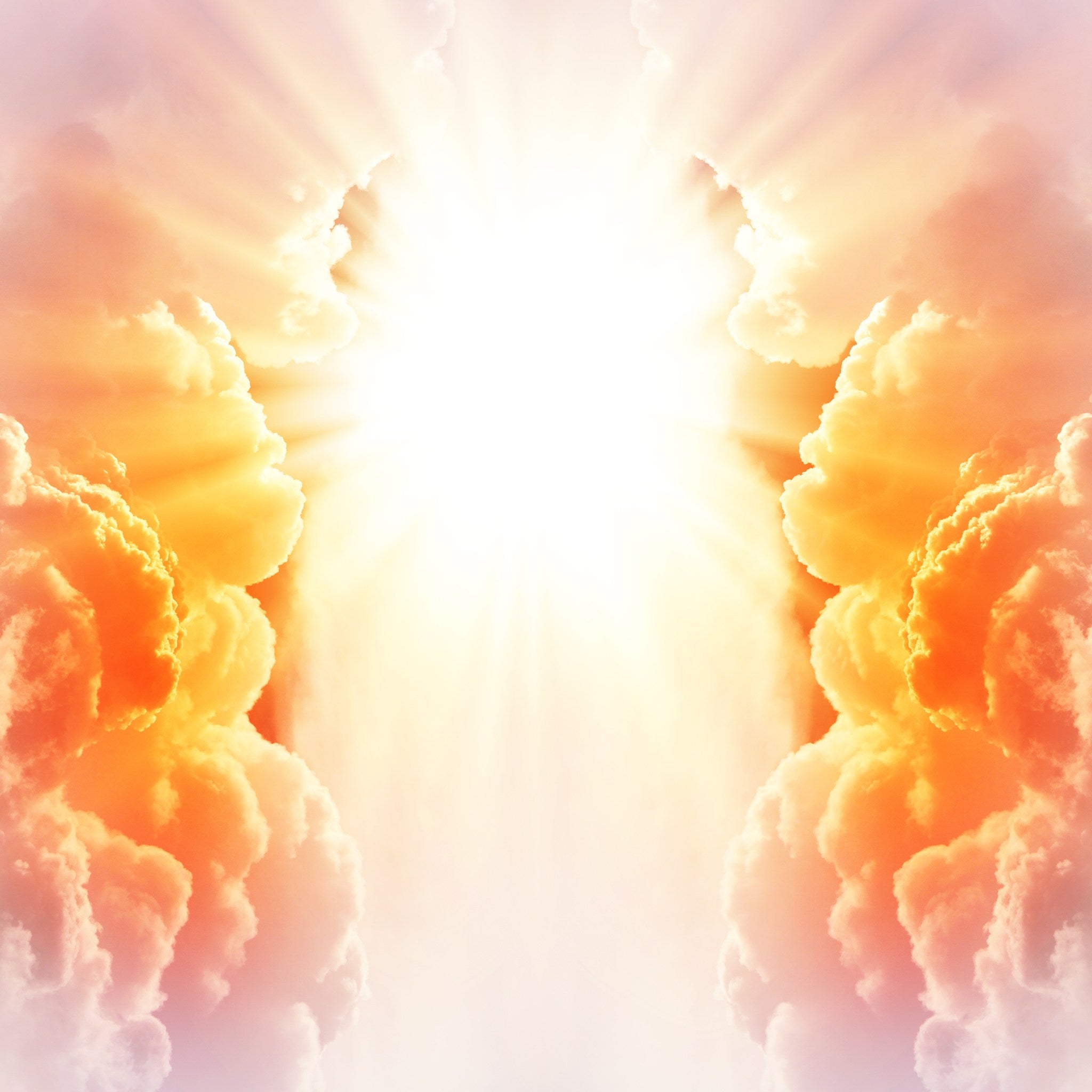 A bright, ethereal sky scene showing a massive opening in the clouds, from which intensely bright, golden-white light radiates outwards. The clouds on either side are thick and fluffy, with warm orange and pink colouring, representing the divine energy of the abundance angel numbers.