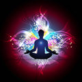 Silhouette of a person meditating with colourful, swirling lights on a dark background.
