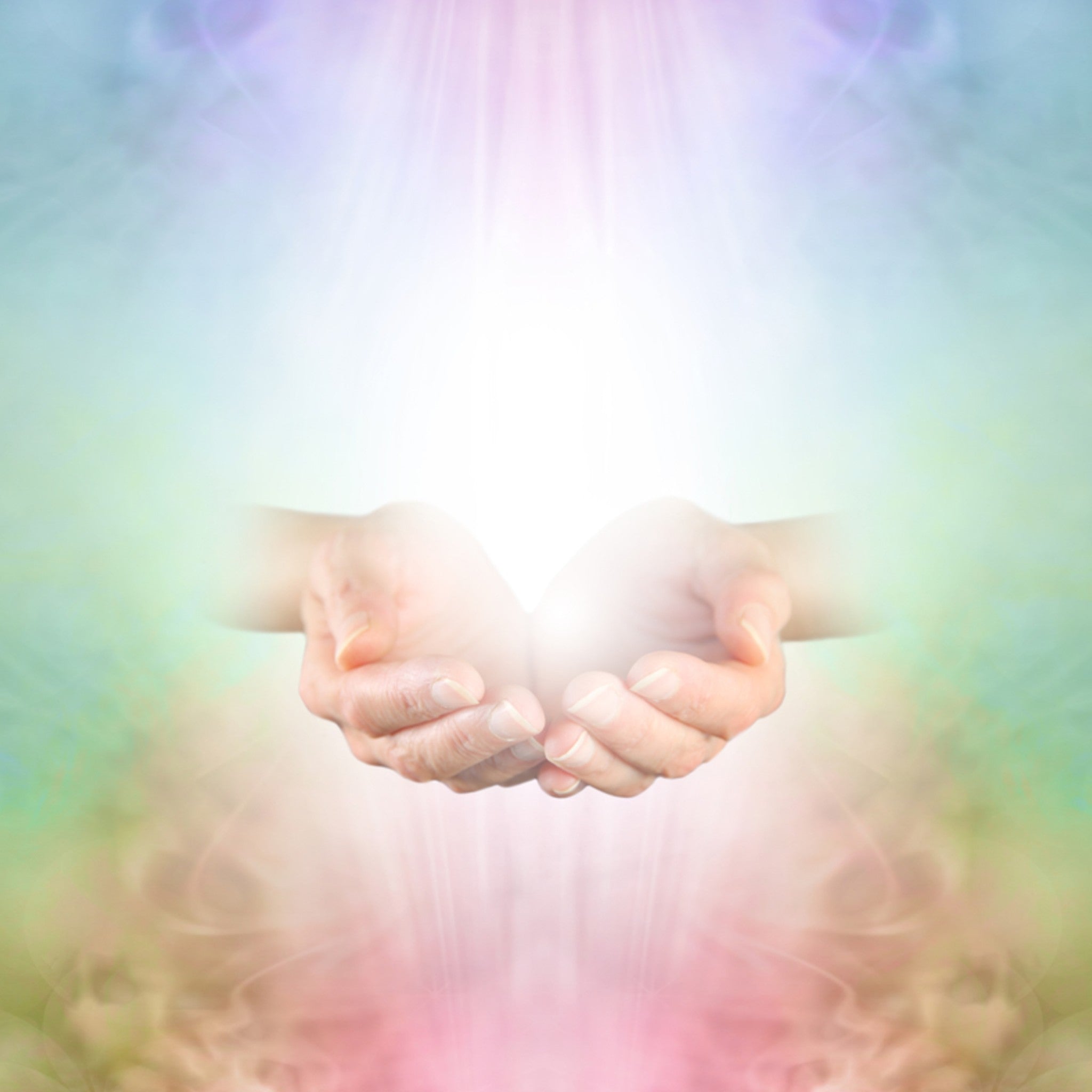 Advanced Reiki Attunement Package: a pair of cupped hands receiving a bright white light from above, surrounded by a soft, pastel, rainbow-coloured aura.