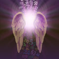 A pair of golden angel wings with coloured numbers, representing angel numbers.