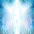 Silhouette of a person against a swirling blue and white angelic energy background