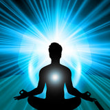 Silhouette of a meditating person with a bright light source behind them on a blue radiating background.