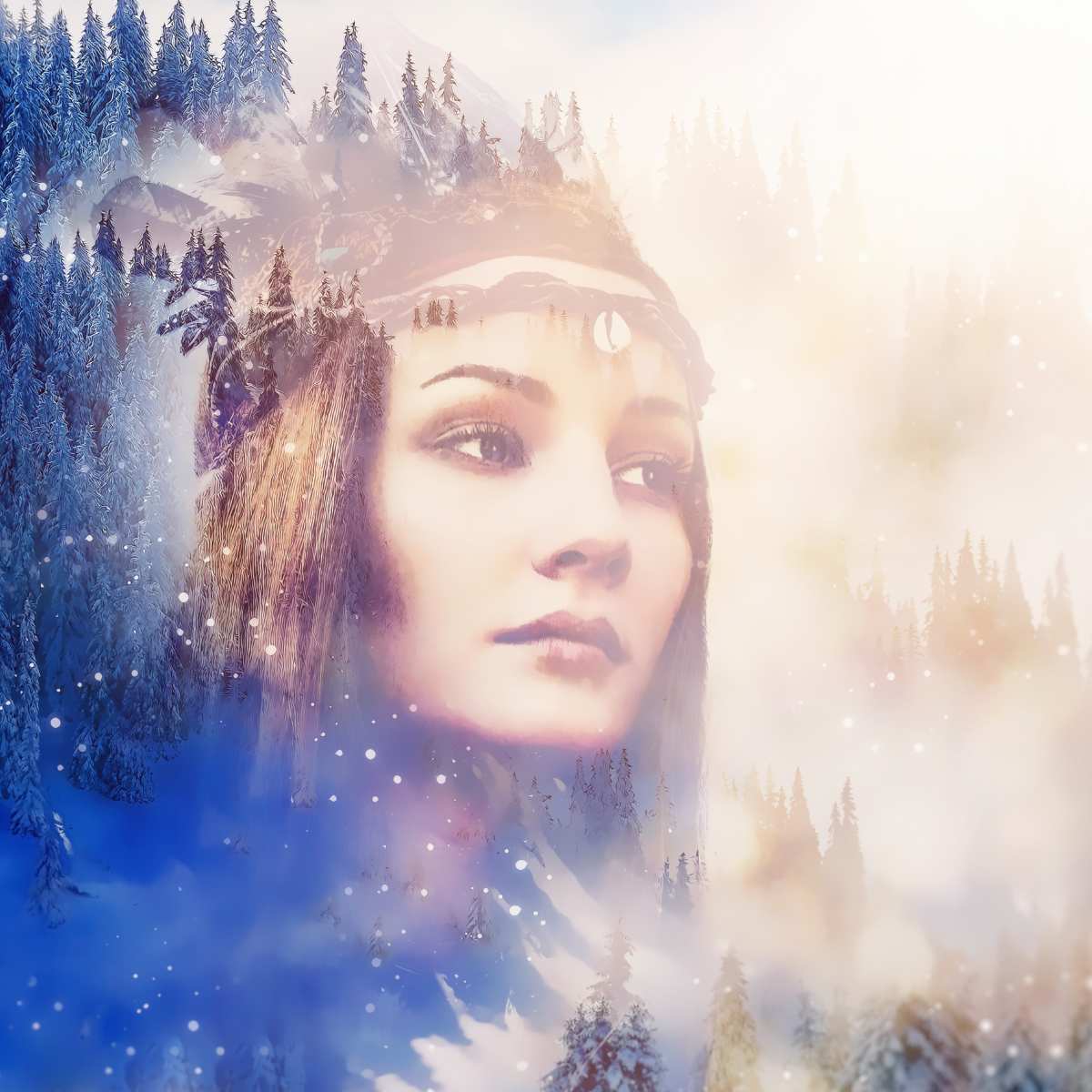 Double exposure of a woman's face with a snowy forest landscape.