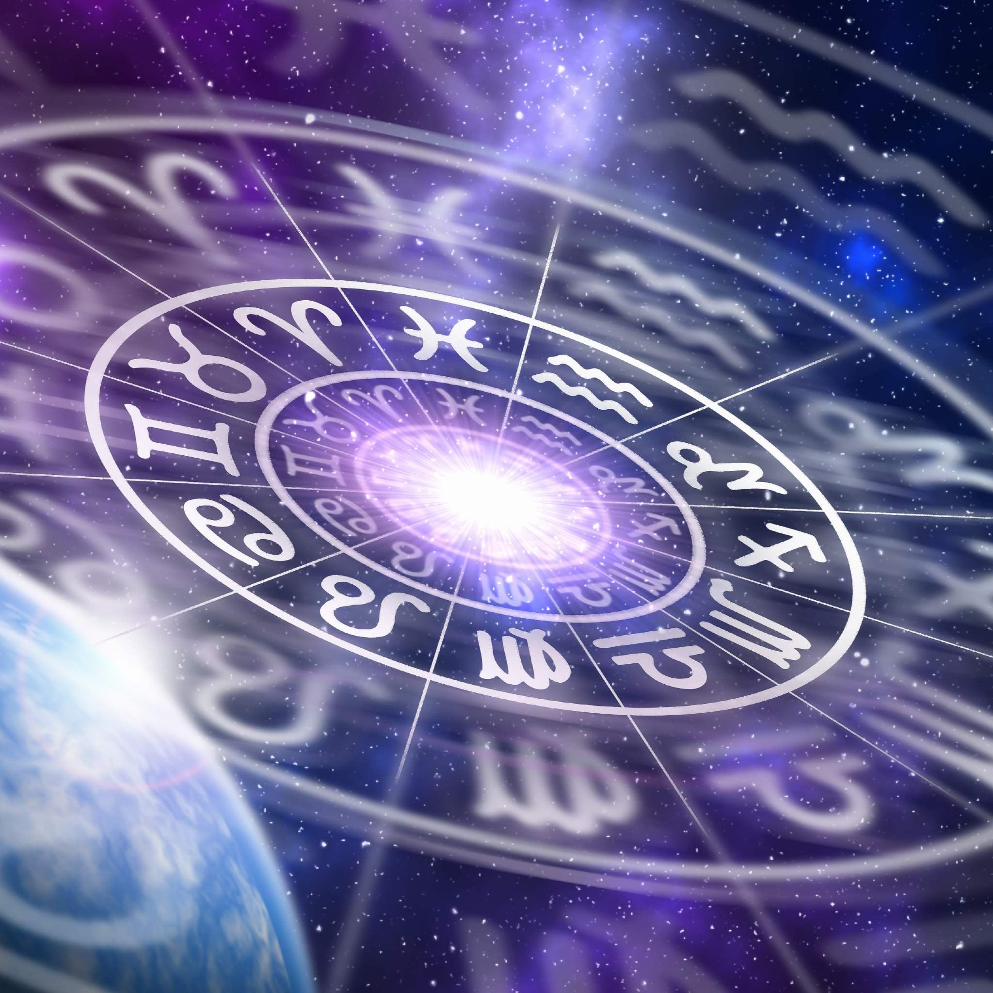 A deep space image featuring a glowing white circle containing the twelve symbolic signs of the Zodiac or astrology wheel, overlaid against a backdrop of stars, nebulae, and a partial view of a planet in the lower right. A bright, violet-hued light emanates from the centre of the wheel, symbolising the spiritual focus of the astrology path alignment dedication.