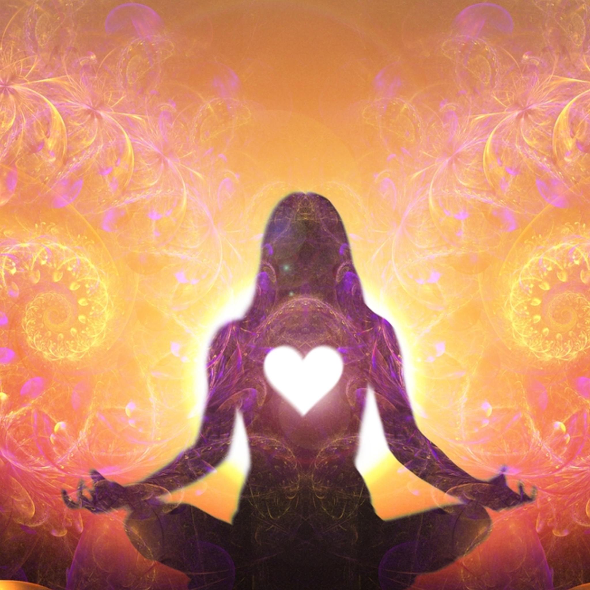 Silhouette of a person in meditation with a heart symbol, surrounded by vibrant mandala patterns.