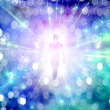 Silhouette of a person against a vibrant, multicoloured light burst background.