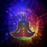Silhouette of a person in meditation with chakra colors and a cosmic background.