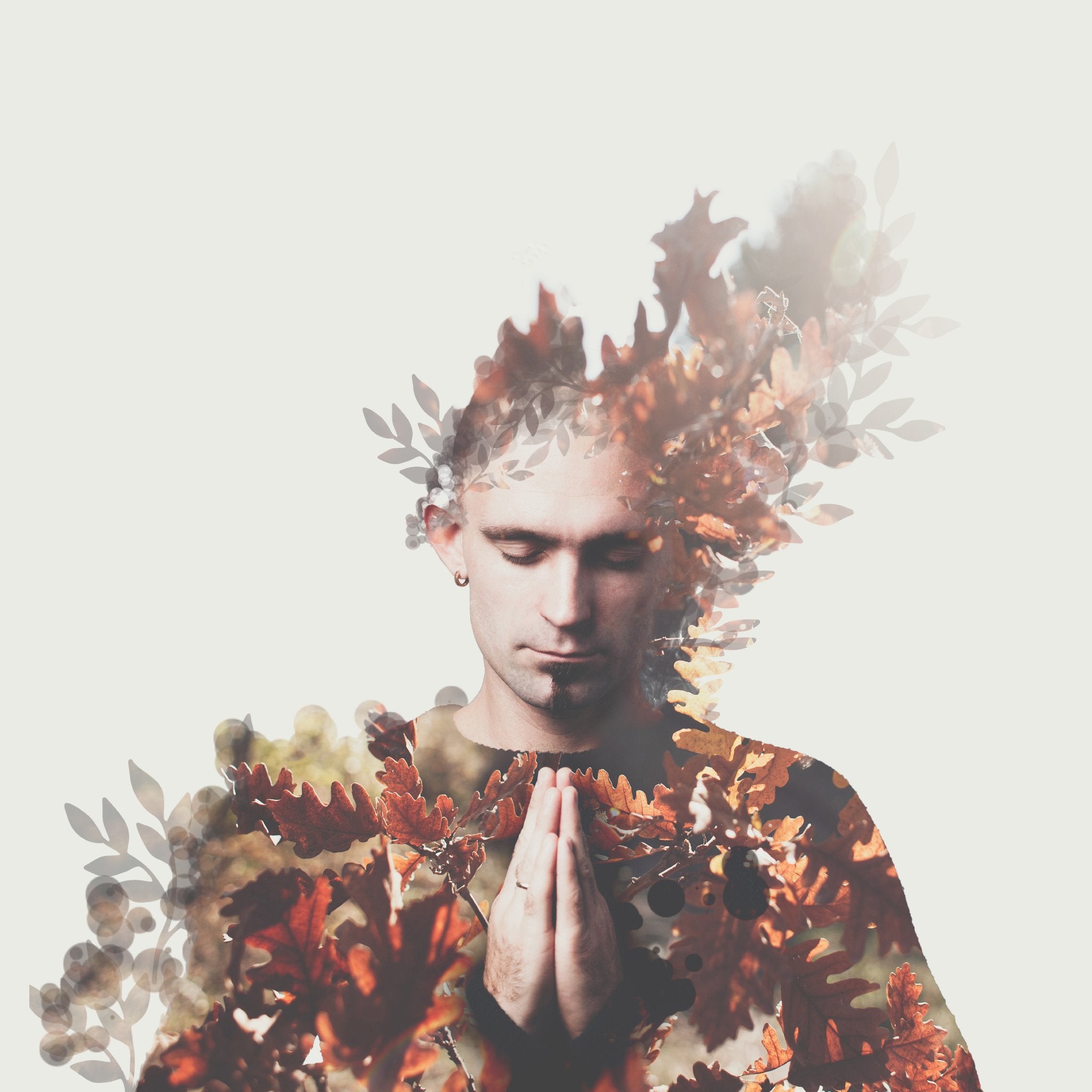 A double exposure photograph showing a man with his eyes closed and his hands clasped in front of his chest, overlaid with vibrant orange and red autumn oak leaves. The visual blend of man and foliage represents connections with seasons and the merging of human and nature.