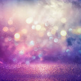 Bokeh effect with purple and pink hues on a blurred background representing fire fairy magic.
