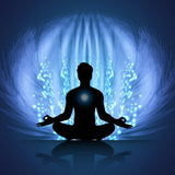 Person meditating with a glowing blue light symbolising the removal of energetic implants from the aura.