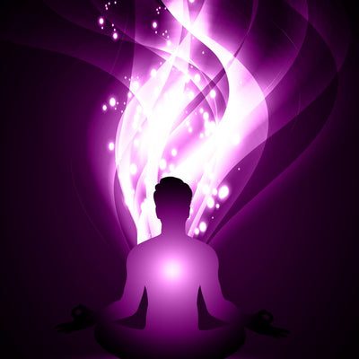 Silhouette of a person meditating with a swirling purple kundalini energy.