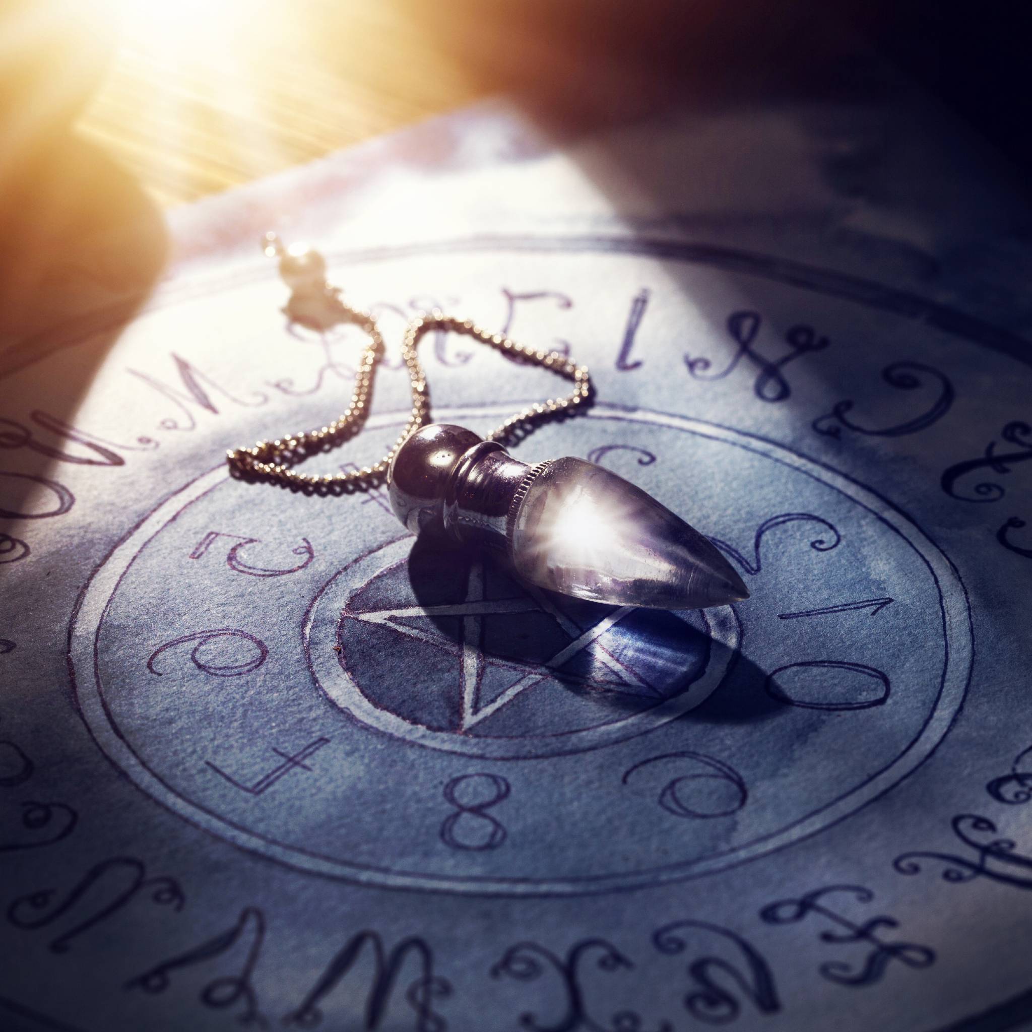 A mystical image depicting a crystal pendulum on a pentagram with sacred symbols and geometric patterns, symbolising magic removal, energetic protection, and spiritual transformation.