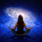 An enlightened person meditating with a galaxy in the background.
