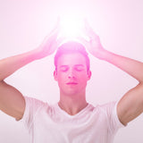 Person with pink energy effect above their Soul Star Chakra on a white background.