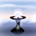 Silhouette meditating above a city, with a glowing third eye light. Suggests life path alignment.