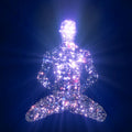 Vibration Increase Treatment: digital illustration of a meditating figure composed entirely of sparkling, high-frequency light against a dark background.