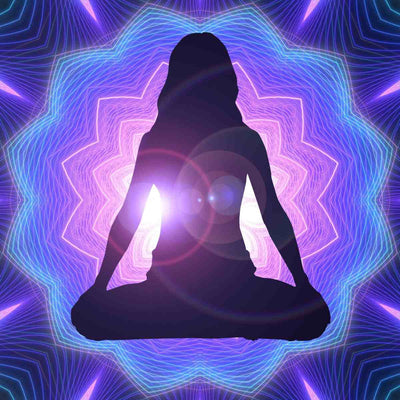 Silhouette of a person in meditation pose against a vibrant, multicoloured geometric background evoking the transformative energy of the violet flame and ascended masters.